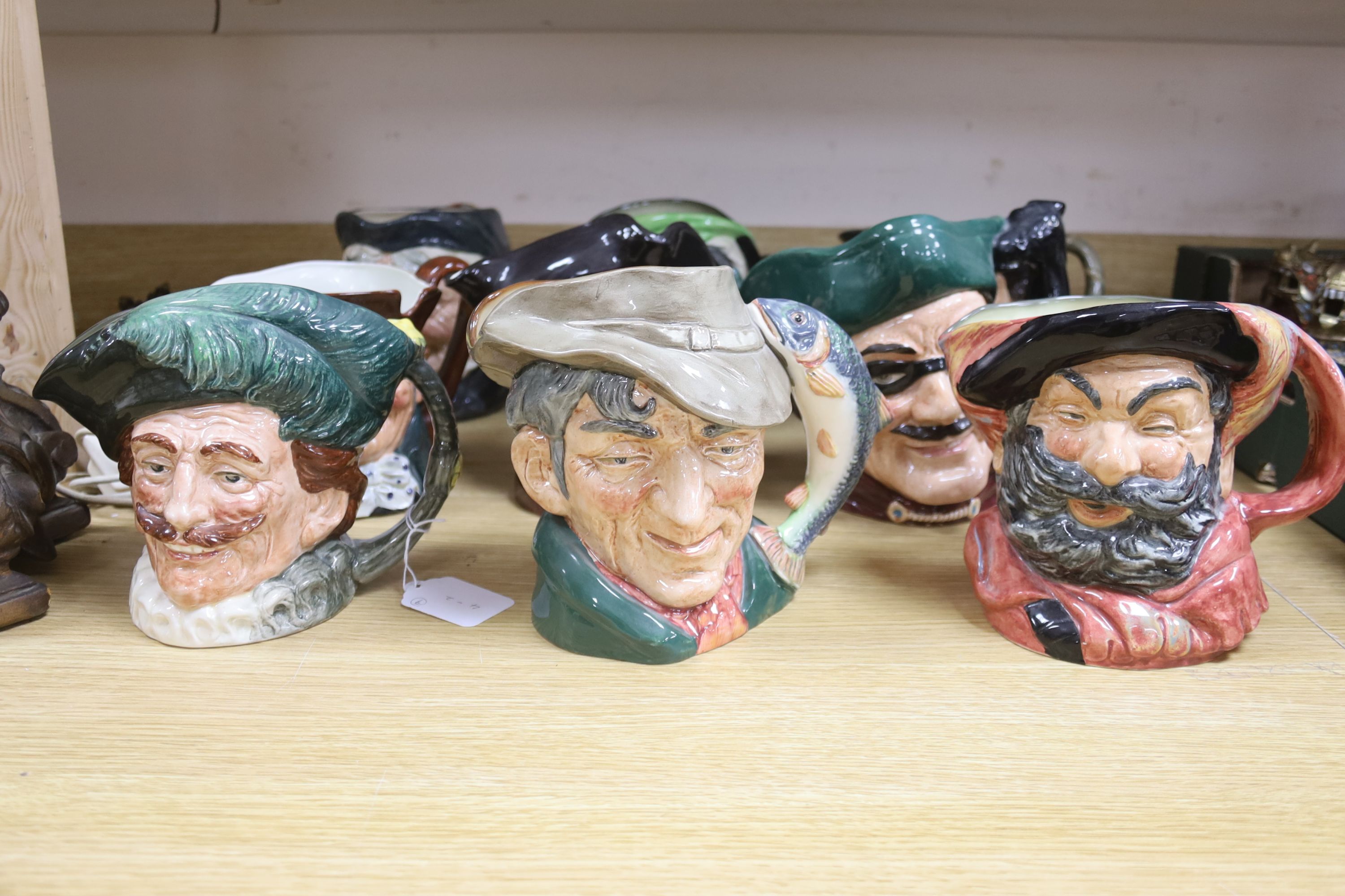 A large collection of nine Royal Doulton character jugs including Falsestaff, The Poacher, Old Charley, Mine Host, Dick Turpin, Granny and three others